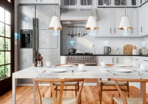 interior of white kitchen and smart remote home control system with app icons connected home